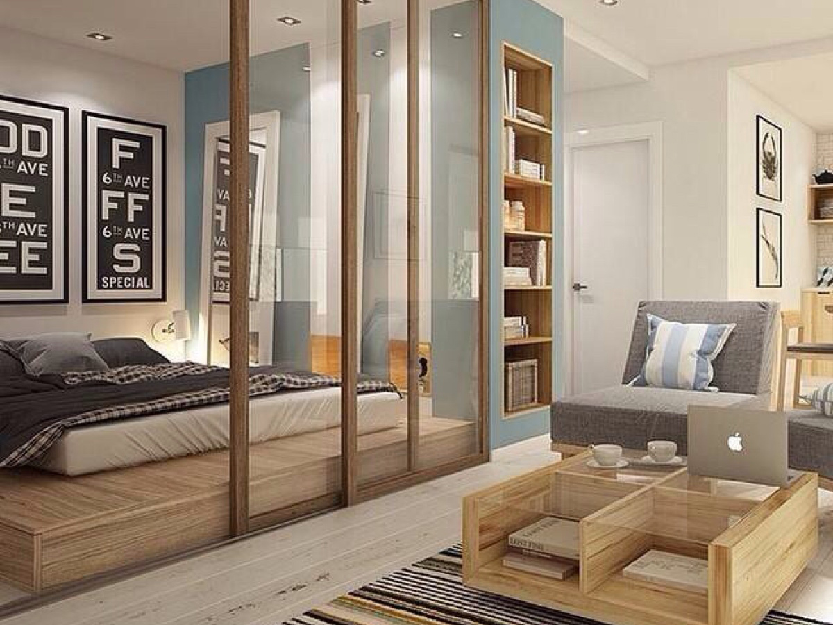 卧室# #隔断# 房子面积不大,因此利用木框玻璃移门来作为空间隔断,使图片